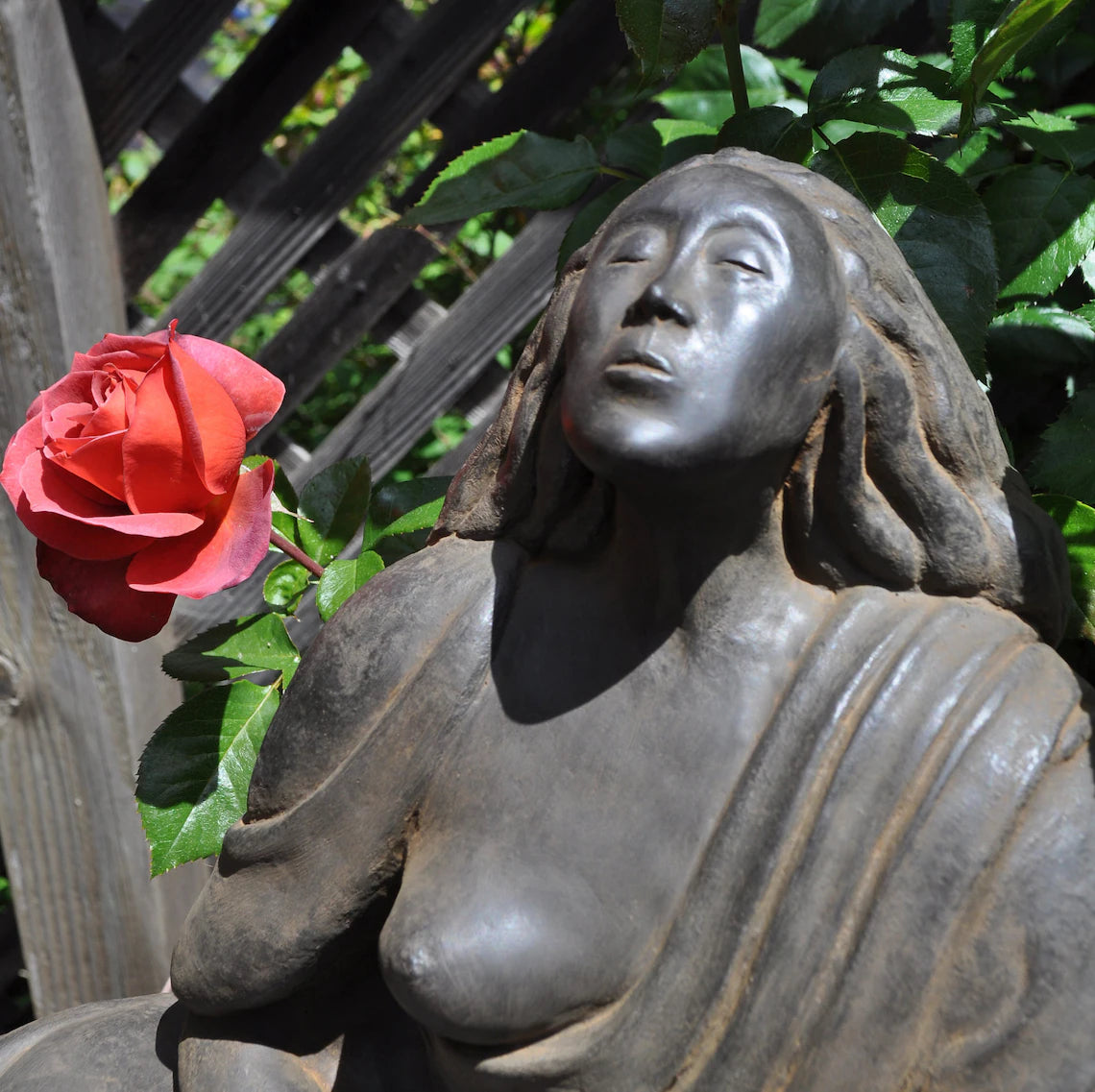 Close up of face Sigrid Herr small Western Buddha sculpture feminine art meditation statue