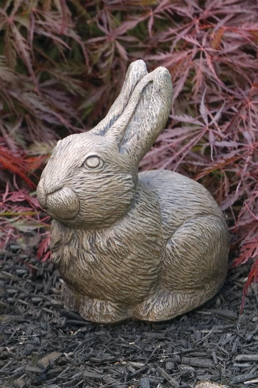 Decorative seated rabbit statue in cast stone for spring garden display