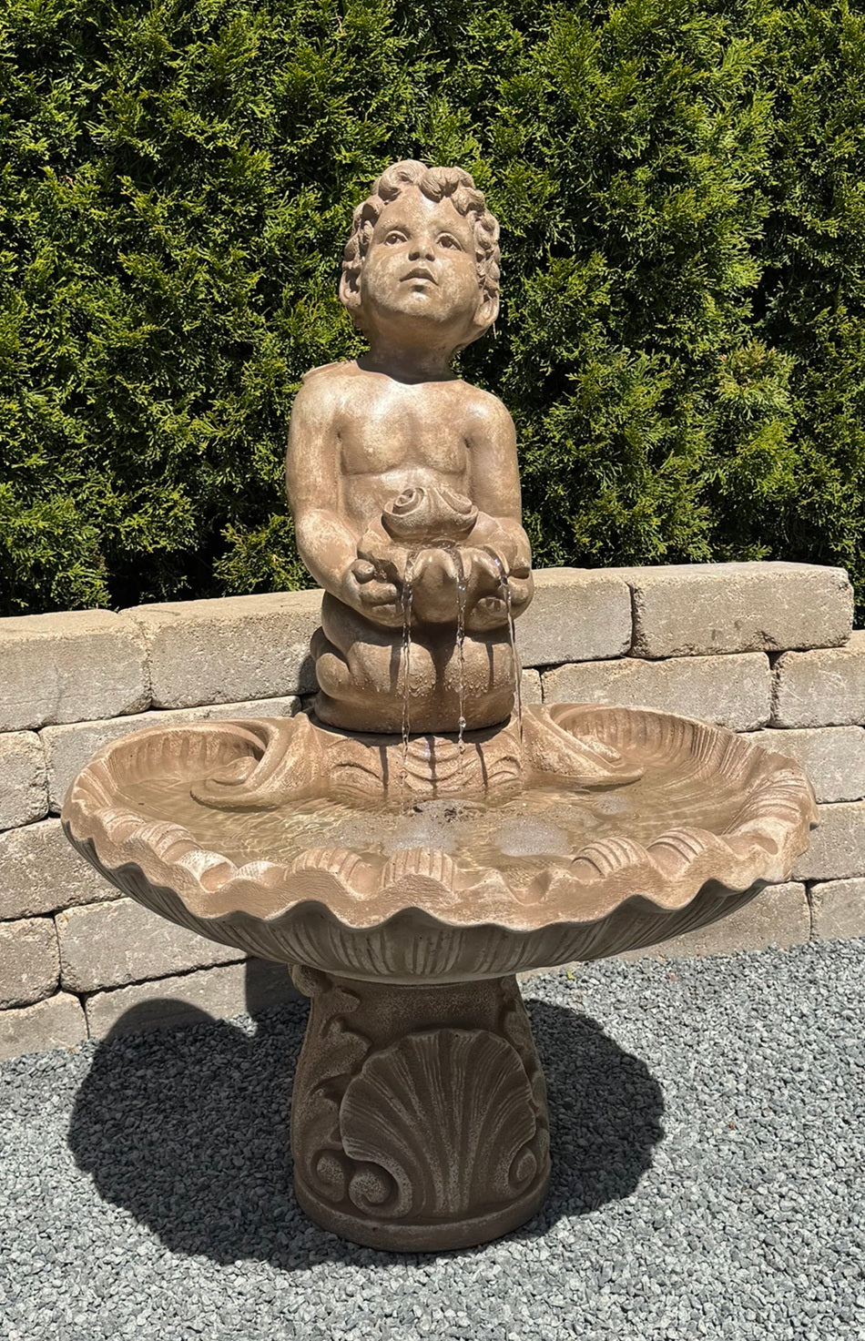 boy cherub garden fountain cast stone holding shell Italian inspired water feature