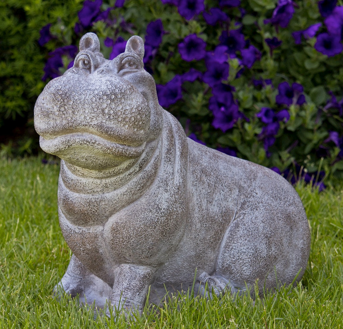 Smiling hippopotamus outdoor sculpture with detailed face