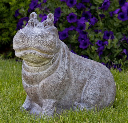 Smiling hippopotamus outdoor sculpture with detailed face