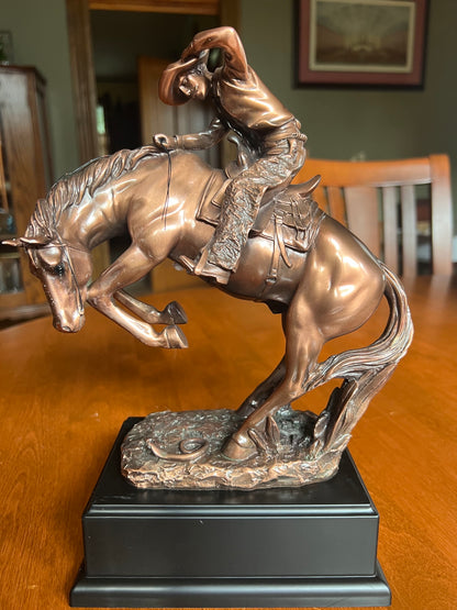 Spooked Stallion Cowboy Sculpture with rattle snake at base bucking horse