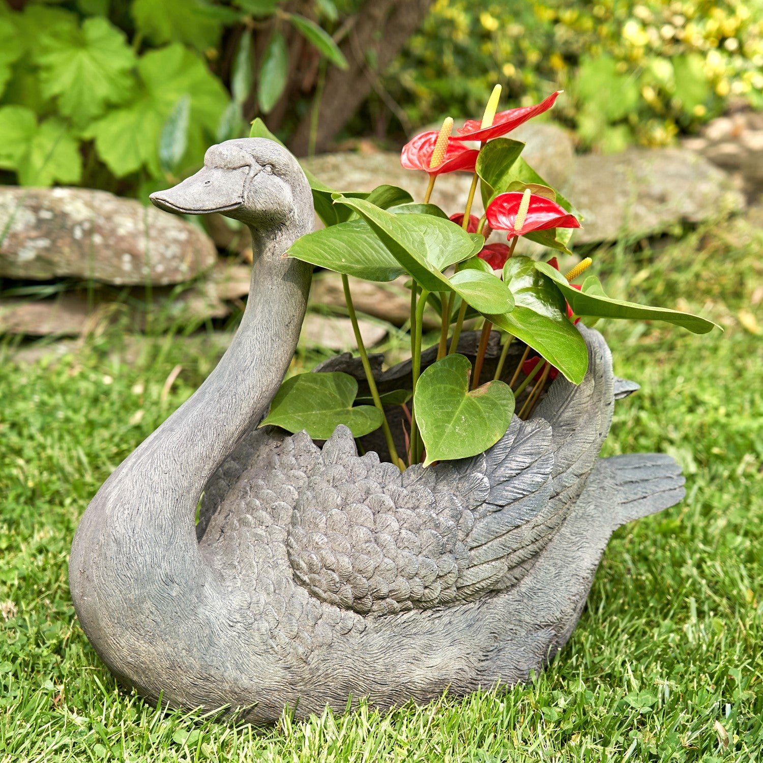 Tall swan planter set with head up and head down garden sculptures holding flowers