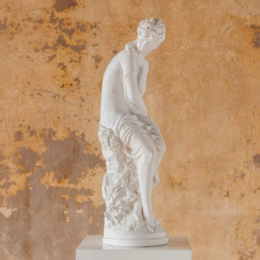 Lady with flowers sculpture portrayal of femininity and natural beauty