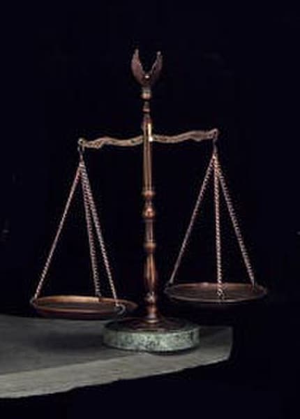 The Justice Scales Statue with eagle flying finial
