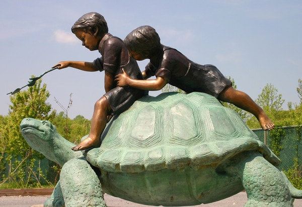 Two Boys Riding Turtle Bronze Statue