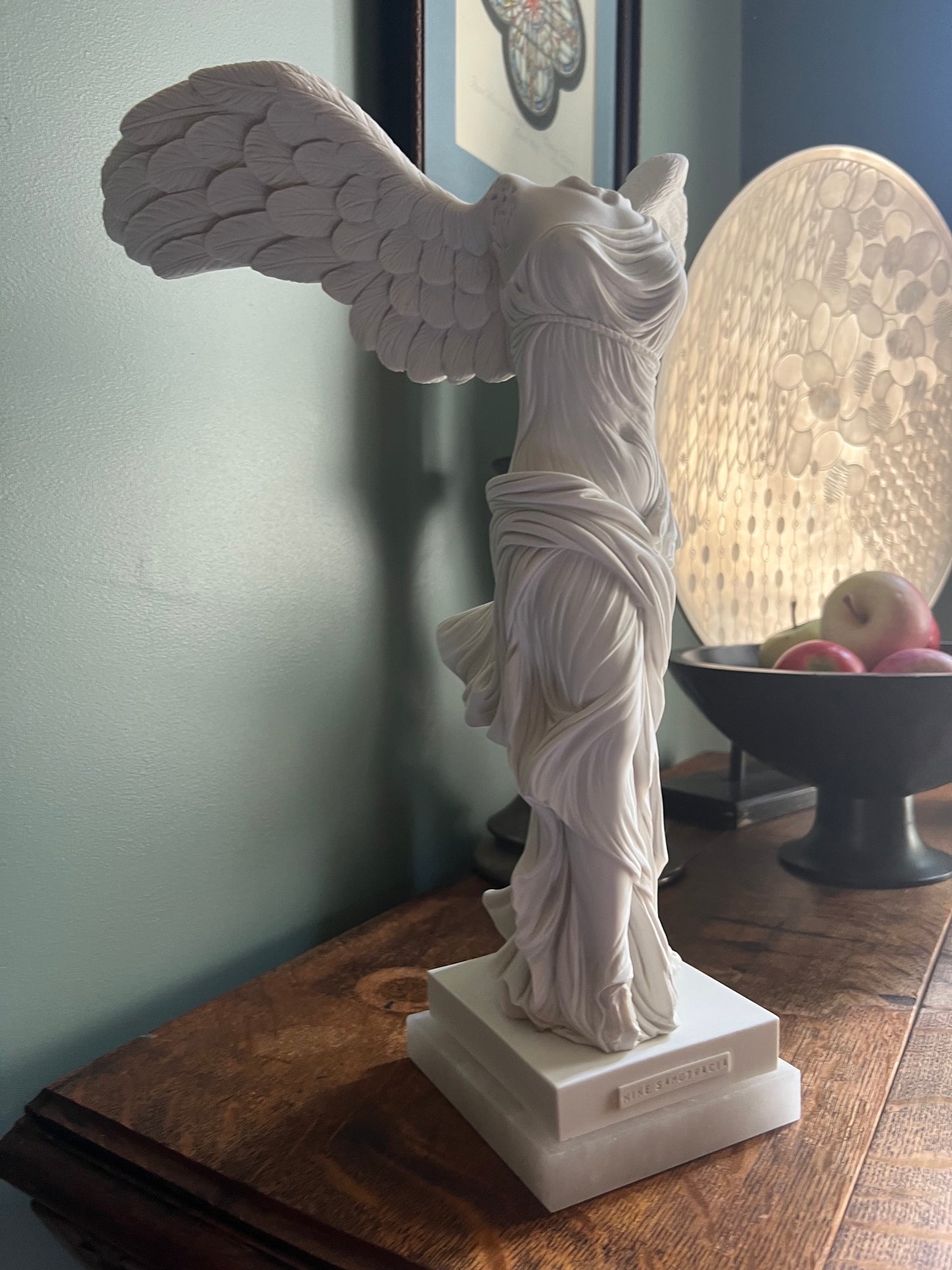 Winged Nike statue inspired by the Louvre Samothrace sculpture