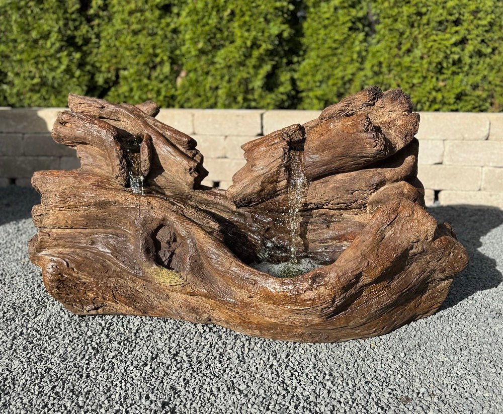 Fallen Logs Fountain Driftwoods Water feature with light in basin