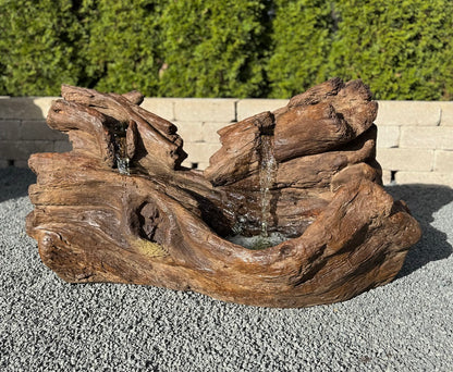 Fallen Logs Fountain Driftwoods Water feature with light in basin