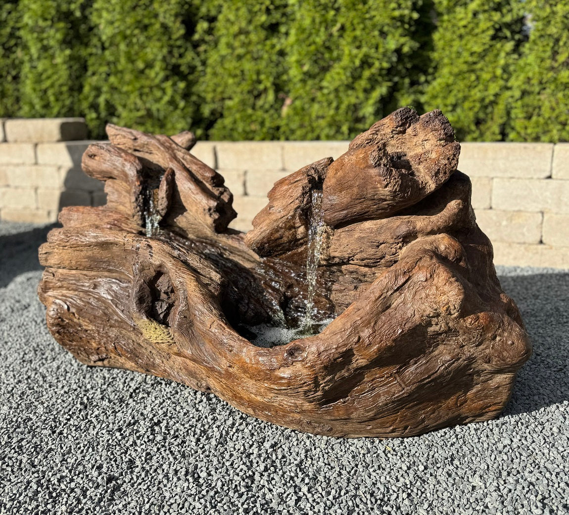 Fallen Logs Fountain Driftwoods Water feature with light in basin flowing falls