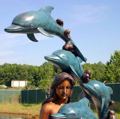 Bronze Mermaid with 8 Dolphins is a mesmerizing and enchanting sculpture