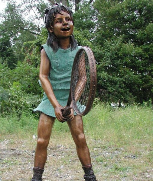 Girl Swinging a Tennis Racket Bronze Statue is a captivating and lifelike representation