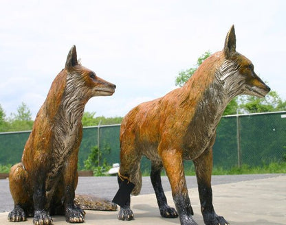 Fox sculptures image showcases two natural wildlife statues set pair
