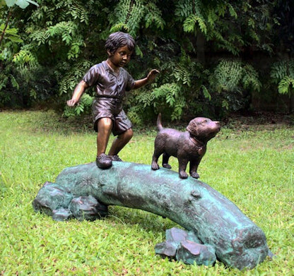 Boy Following Dog Across Log Bronze Statue