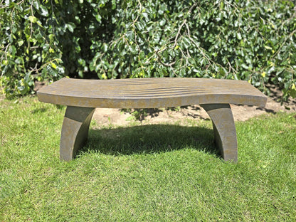 soft Asian-inspired influence Modern outdoor bench with subtle linear detailing