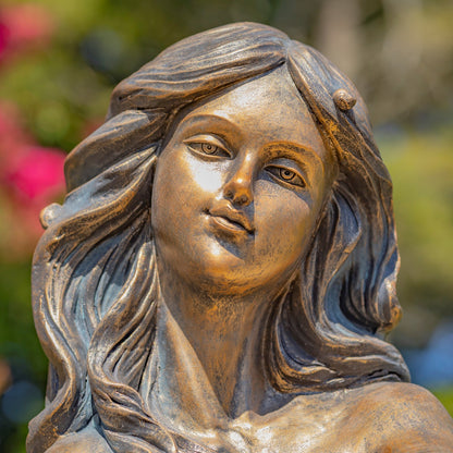 Close-up of the mermaid sculpture showing her serene face and detailed flowing hair