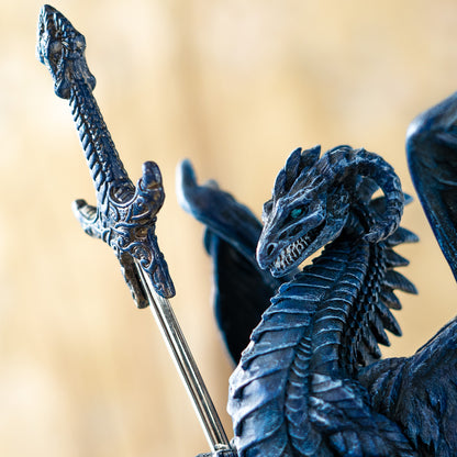 mythical dragon sword letter opener sculpture close up of face and sword