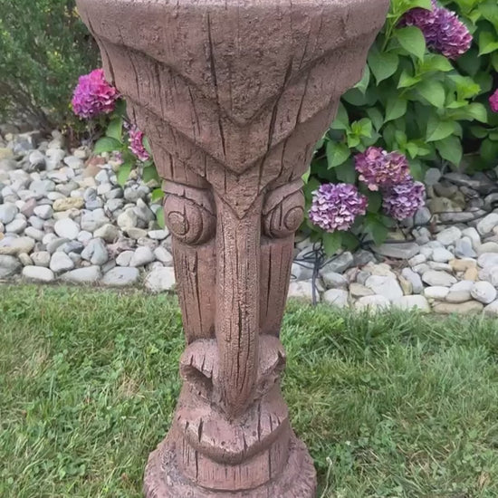 Video Tiki luau outdoor fountain made of cement water flowing from top tropical poolside garden
