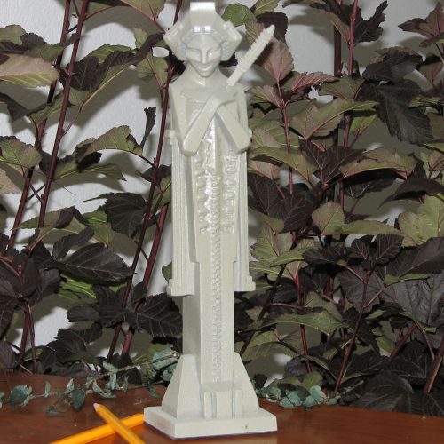 Frank Lloyd Wright garden sprite with baton tabletop sculpture